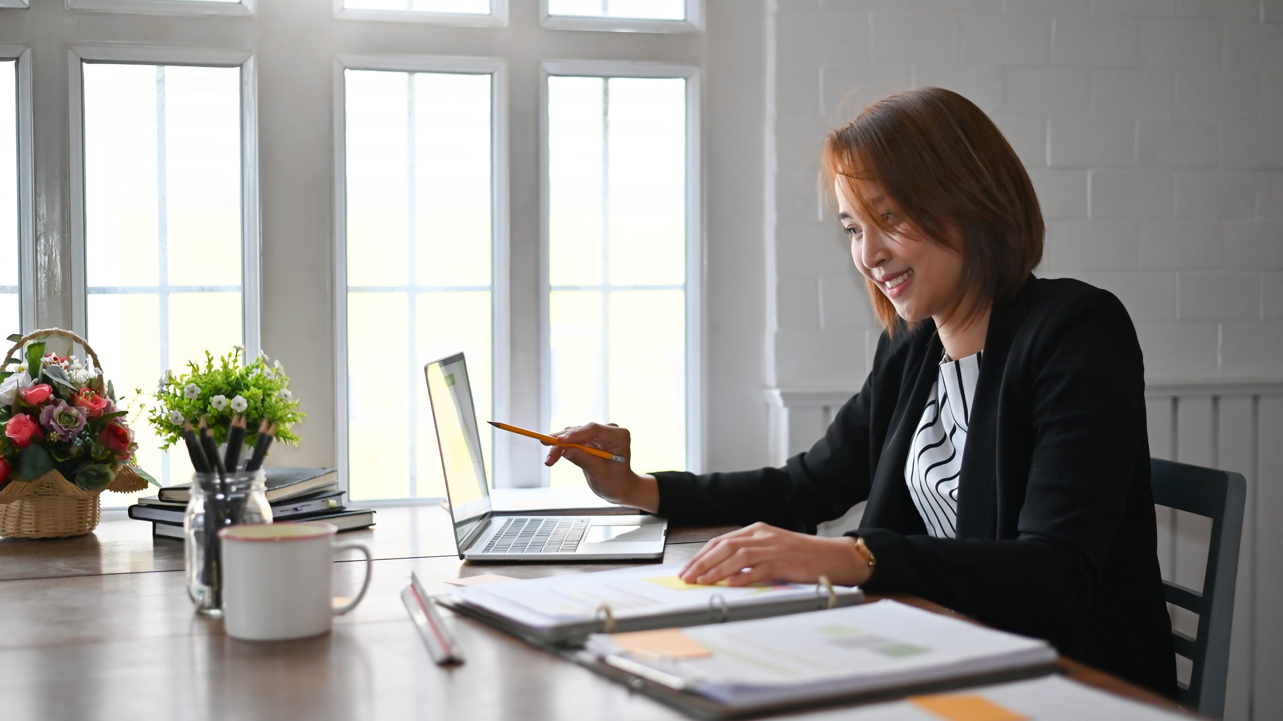Businesswoman working analysis on laptop computer, Business finances and accounting concept.